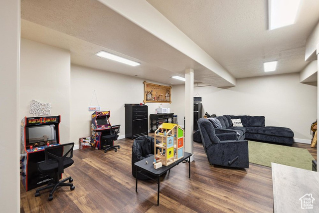 6117 North Rocky Ridge Road Peoa, UT 84061 - Photo 58 of 83 Living room featuring dark wood-type flooring and a textured ceiling