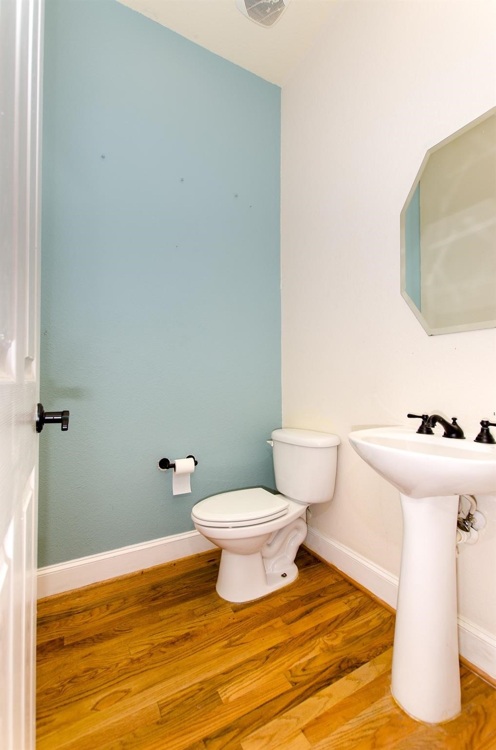308 Grove Street Houston, TX 77020 - Photo 26 of 28 a bathroom with a sink toilet and vanity