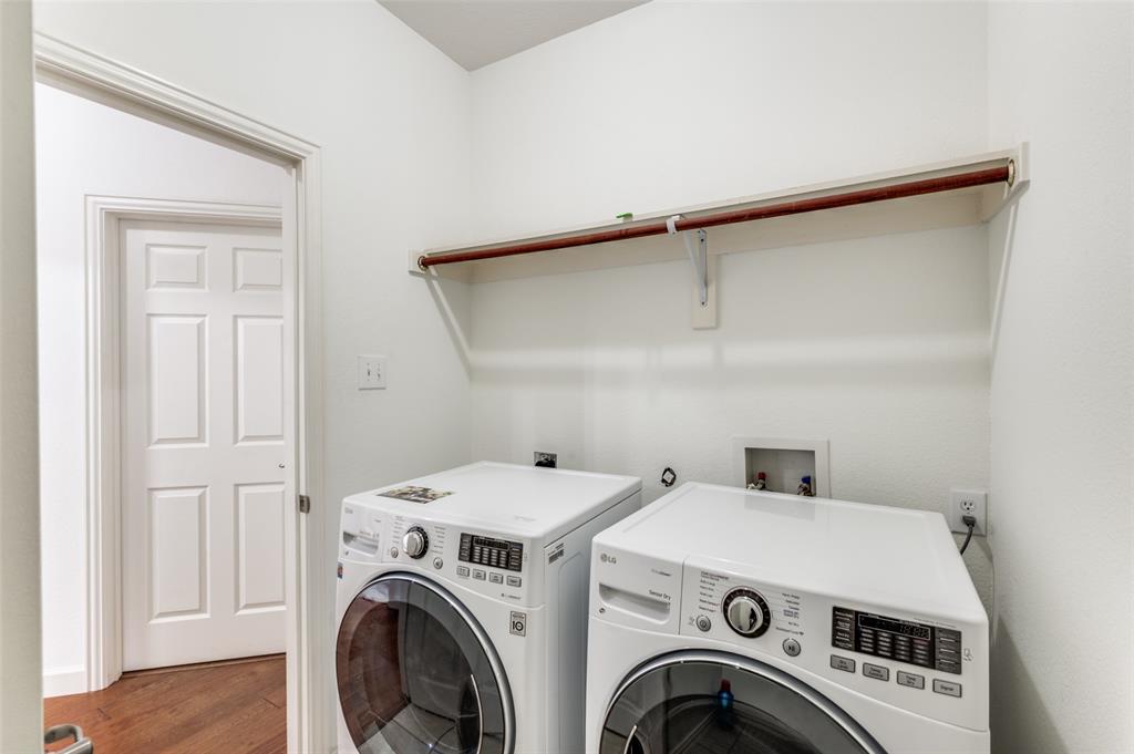 13371 Lime Ridge Drive Frisco, TX 75033 - Photo 11 of 25 Utility area featuring a wall-mounted shelf with a hanging rod