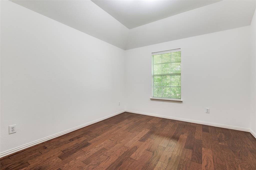 13371 Lime Ridge Drive Frisco, TX 75033 - Photo 14 of 25 The room features a tray ceiling, hardwood floors, and a window with blinds