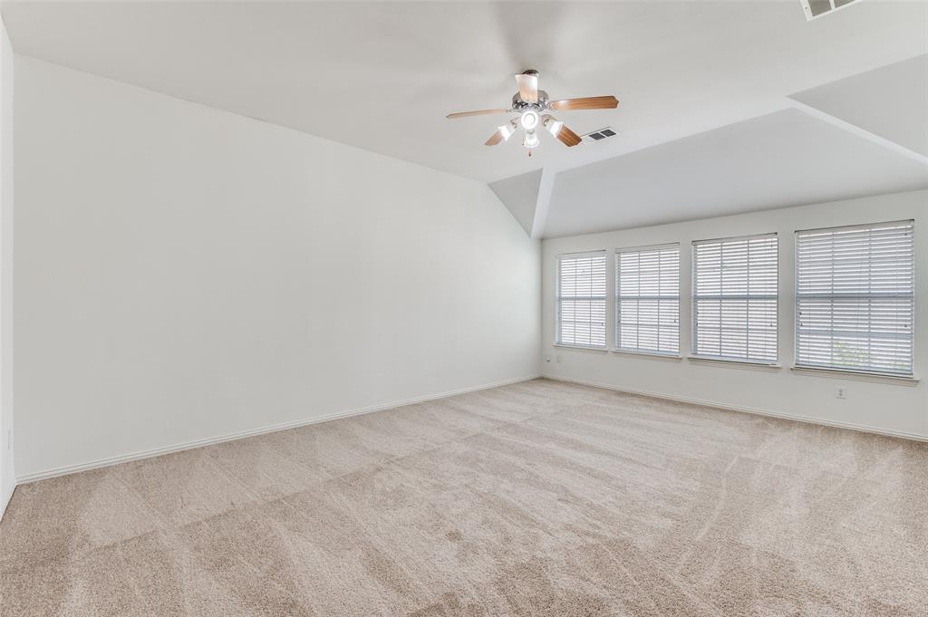 13371 Lime Ridge Drive Frisco, TX 75033 - Photo 18 of 25 Spacious room featuring light-colored carpet, white walls, and a series of four windows with blinds