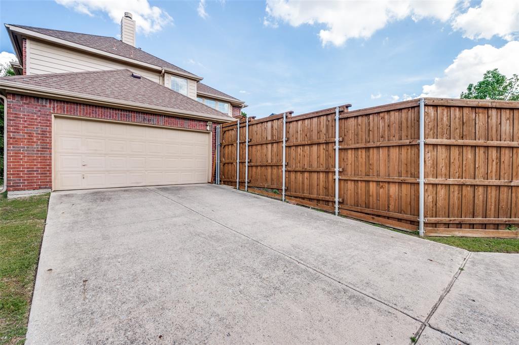 13371 Lime Ridge Drive Frisco, TX 75033 - Photo 25 of 25 The property features a two-story exterior with brick siding and a tan garage door