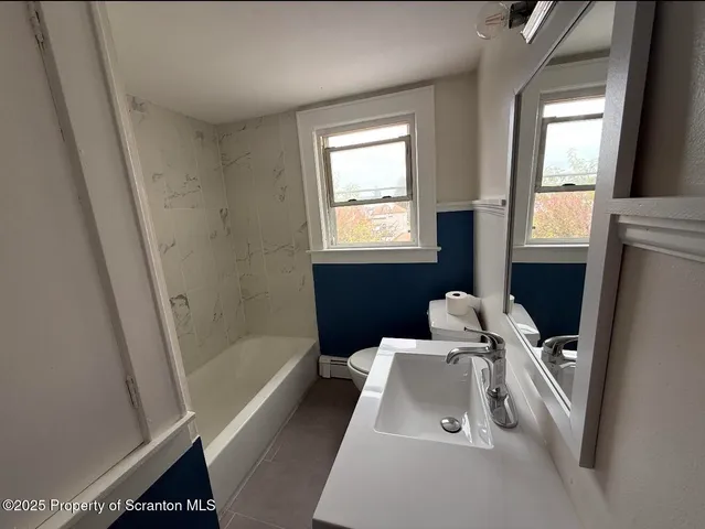 a bathroom with a sink and a bathtub