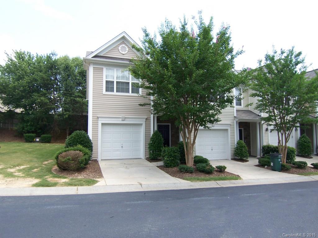 2117 Midnight Blue Lane, Unit 194 Fort Mill, SC 29708 - Photo 1 of 11 a front view of a house with a yard and garage