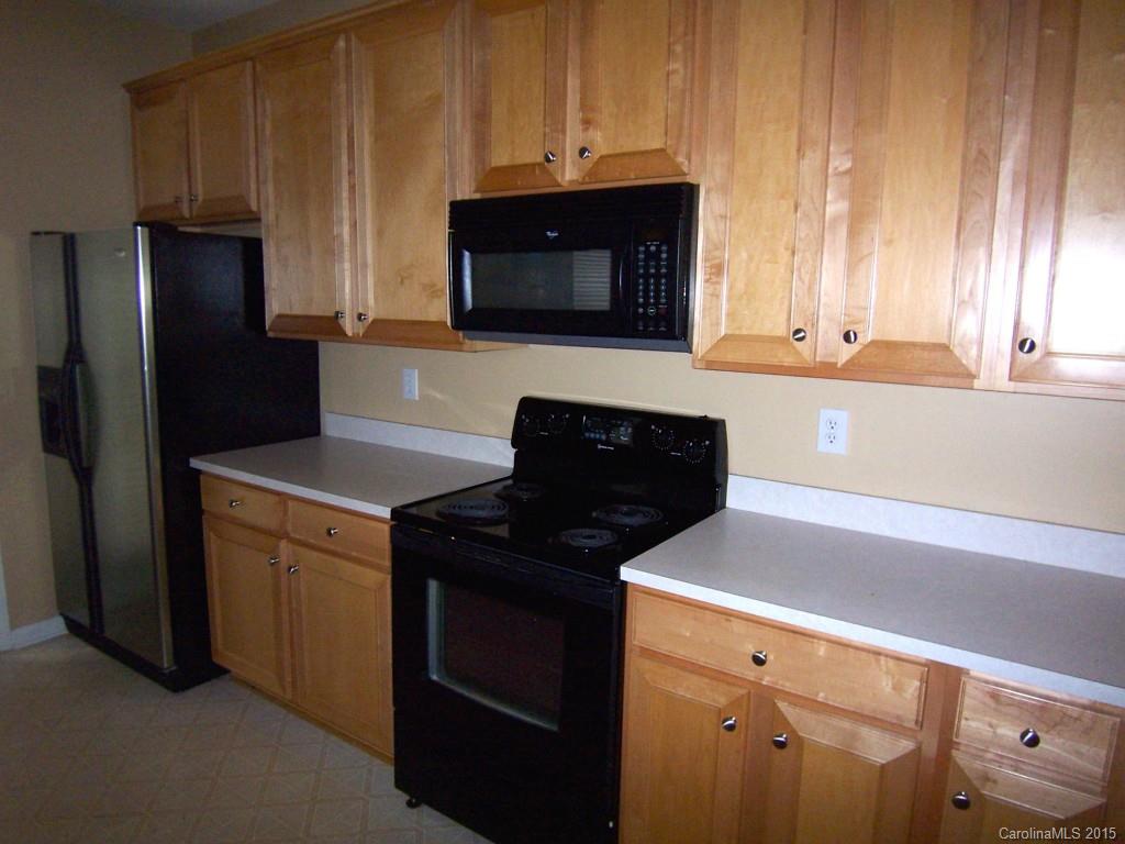 2117 Midnight Blue Lane, Unit 194 Fort Mill, SC 29708 - Photo 5 of 11 a kitchen with a refrigerator stove and microwave