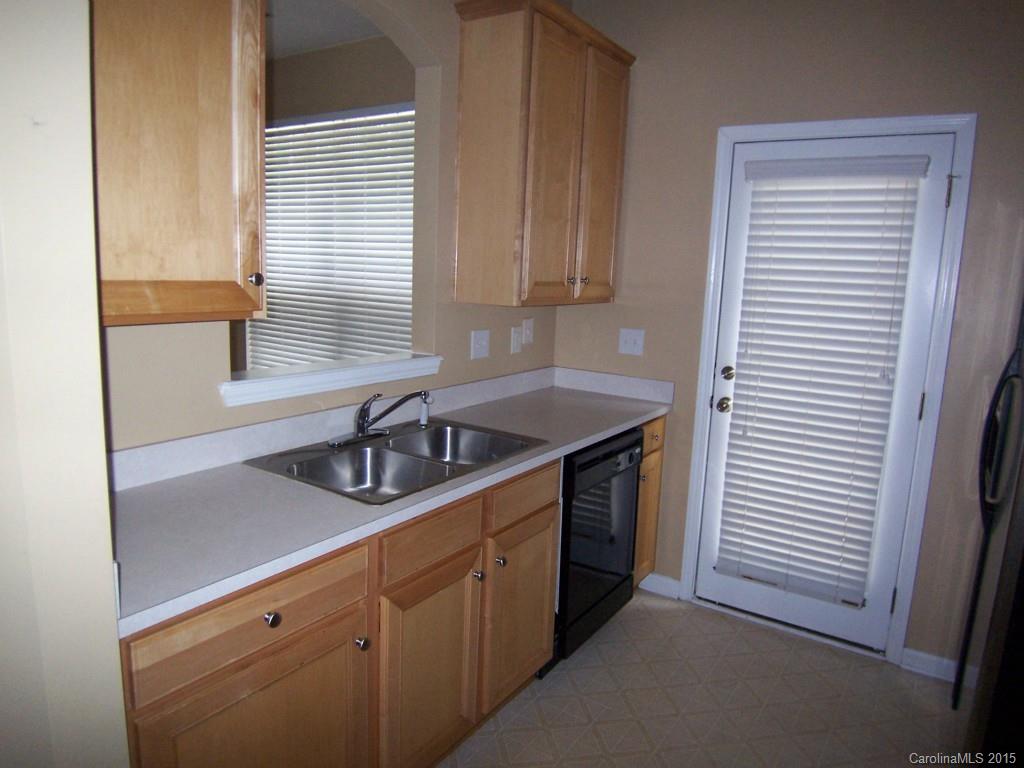 2117 Midnight Blue Lane, Unit 194 Fort Mill, SC 29708 - Photo 6 of 11 a kitchen with granite countertop cabinets sink and window