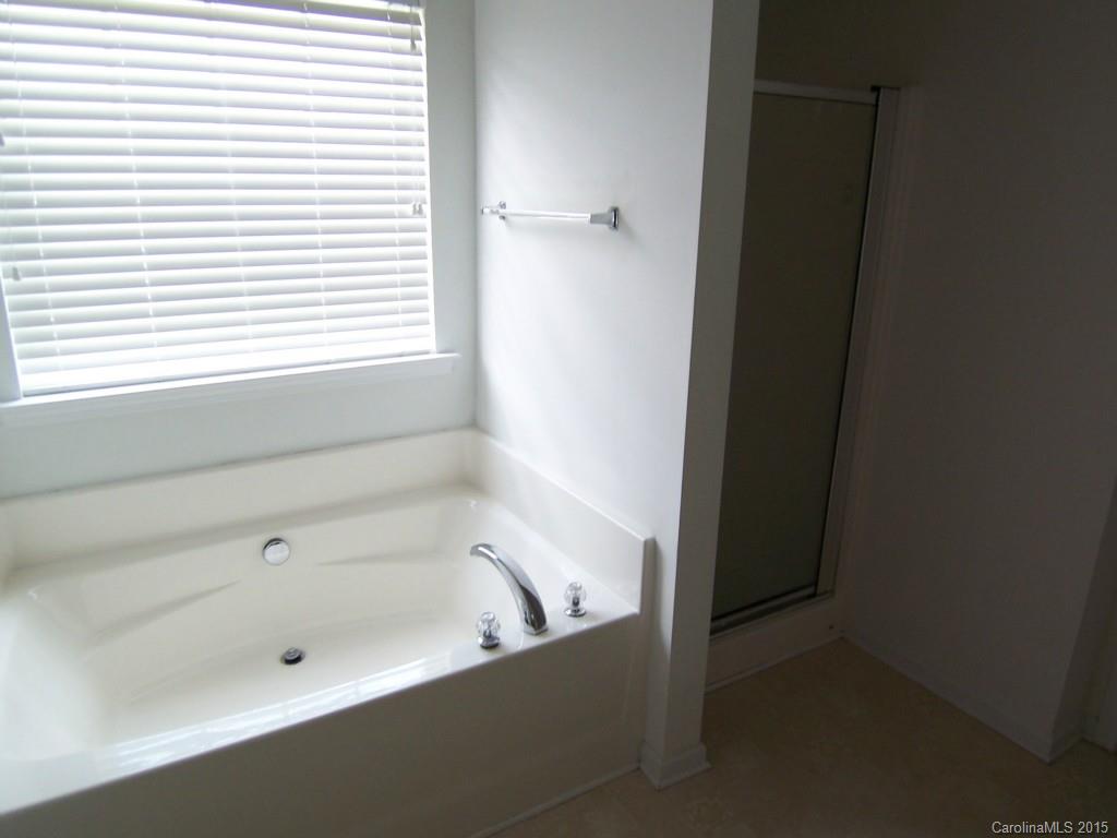 2117 Midnight Blue Lane, Unit 194 Fort Mill, SC 29708 - Photo 8 of 11 a bathroom with a bathtub