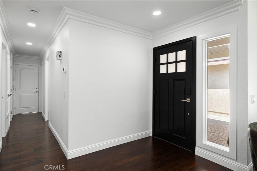 3004 Cardamon Street Rialto, CA 92376 - Photo 28 of 60 Foyer with Modern Black Front Door & Crown Molding, Hardwood Flooring