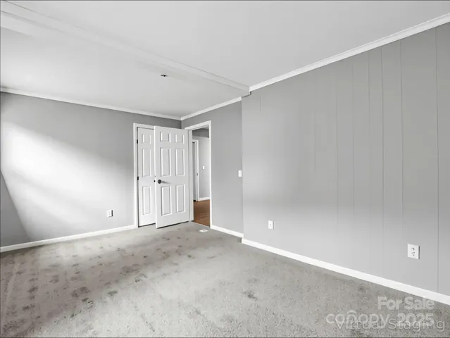 a view of room with window and ceiling fan