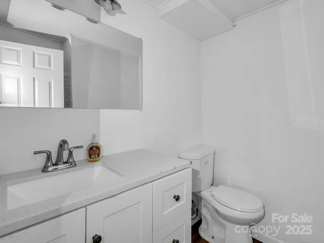 a view of a patio with a table chairs and a backyard