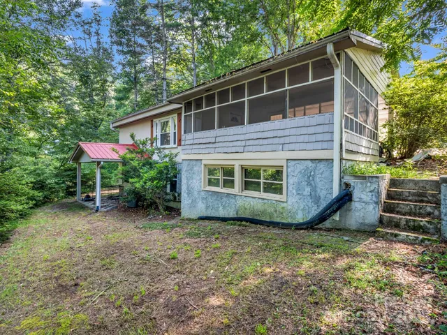 a view of empty room with floor to ceiling window