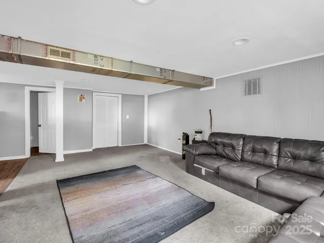 a view of an empty room and wooden floor
