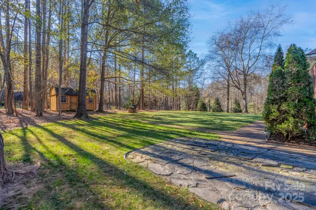a backyard of a house with lots of green space