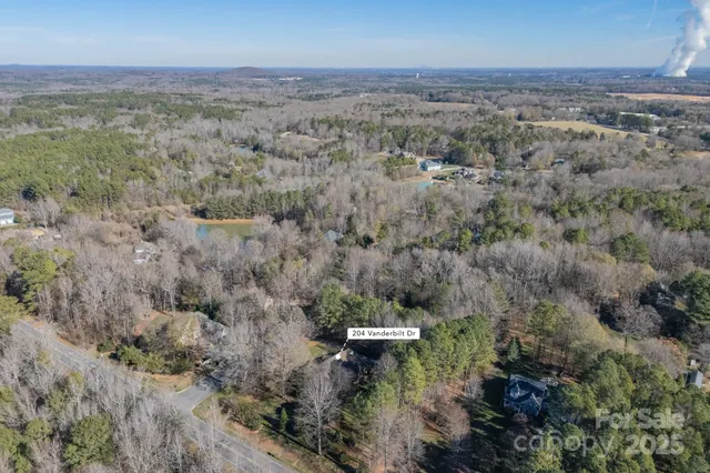 a view of a city with lush green forest