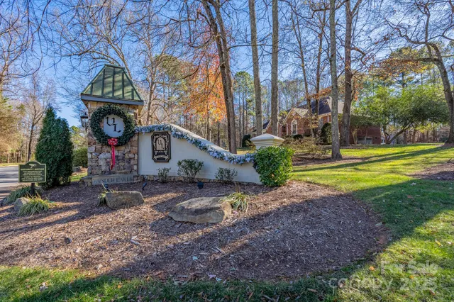 a view of a park with iron fence