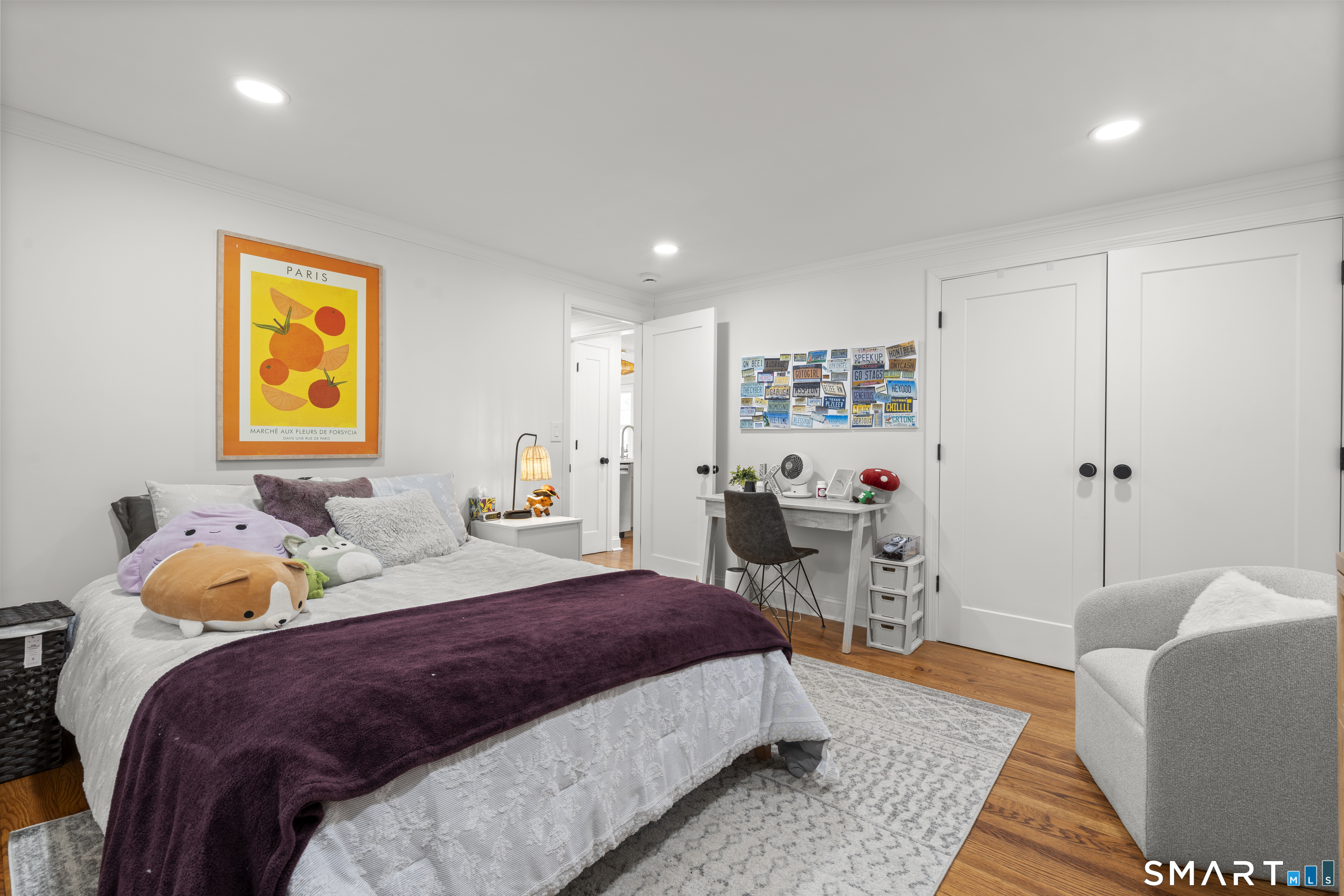 180 Ruane Street, Unit 1 Fairfield, CT 06824 - Photo 20 of 20 a bedroom with a bed and a couch