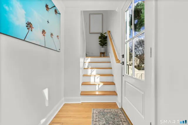 a view of entryway with wooden floor