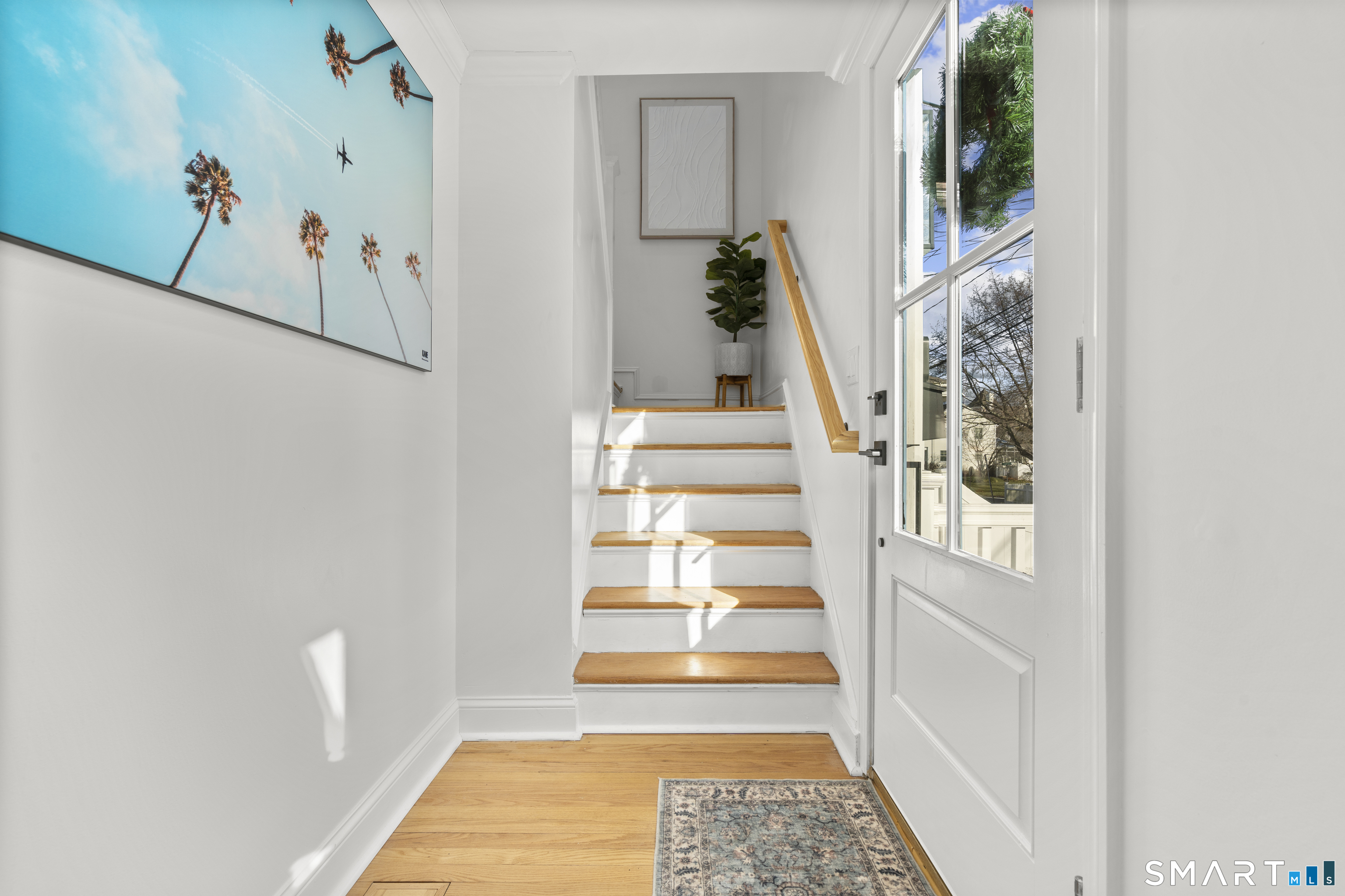 180 Ruane Street, Unit 1 Fairfield, CT 06824 - Photo 3 of 20 a view of entryway with wooden floor