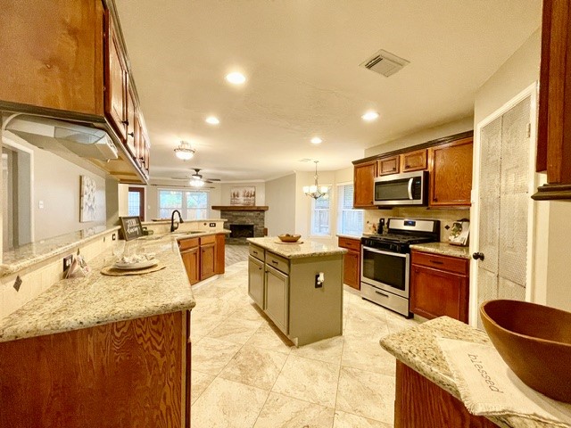 13506 Spring Court Tomball, TX 77375 - Photo 9 of 37 a large kitchen with granite countertop lots of counter top space