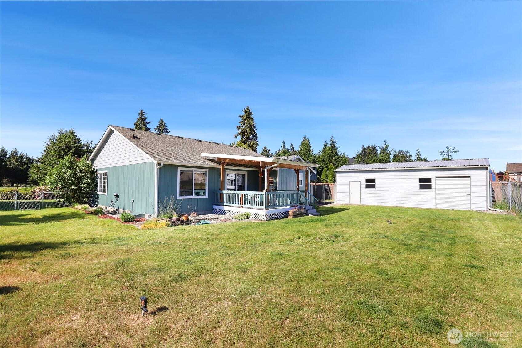 8008 188th Avenue Southwest Rochester, WA 98579 - Photo 37 of 40 a house with green field in front of it
