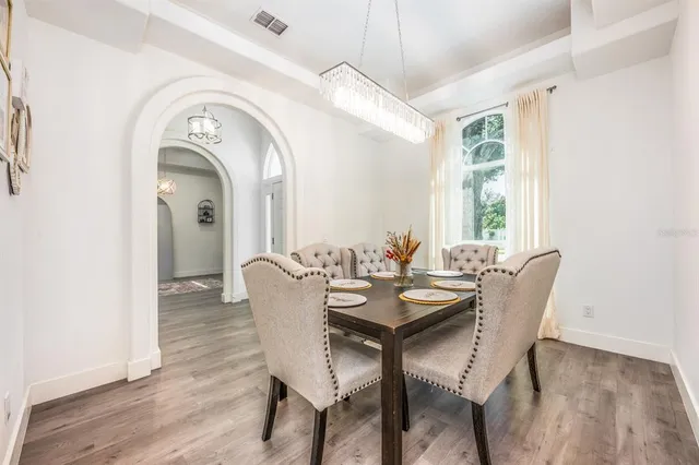 a view of a dining room with furniture window and outside view