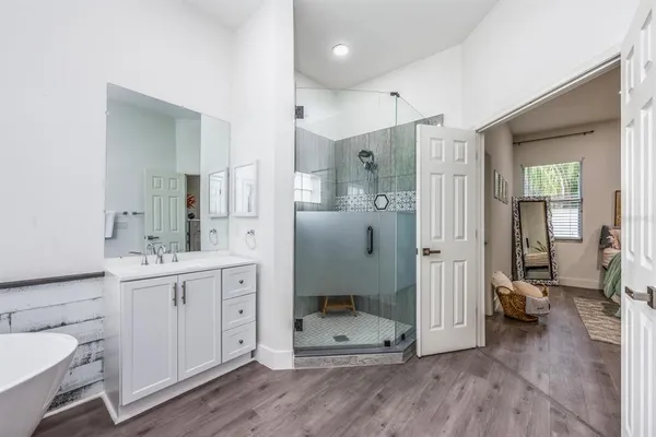 a view of a hallway view with wooden floor and staircase