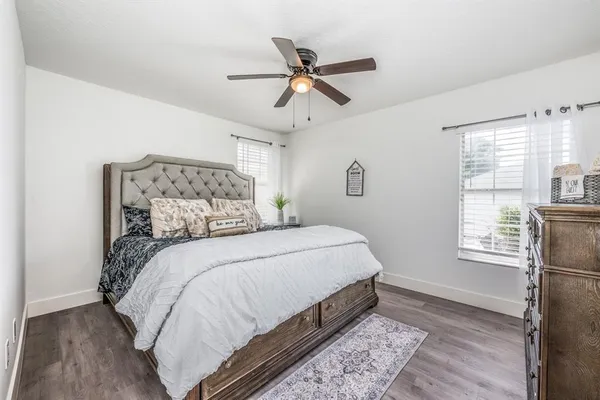a bedroom with bed and window