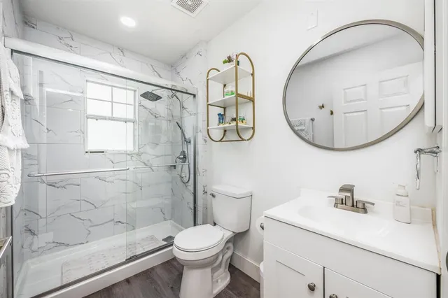 a bedroom with bed and window