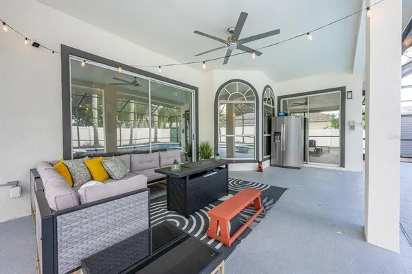 a living room with furniture and a large window