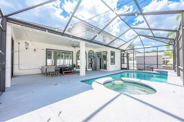 a bathroom with a tub and window