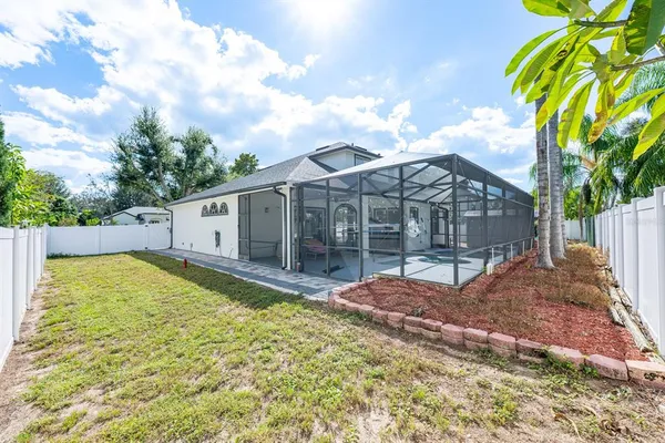 a view of a backyard with a patio