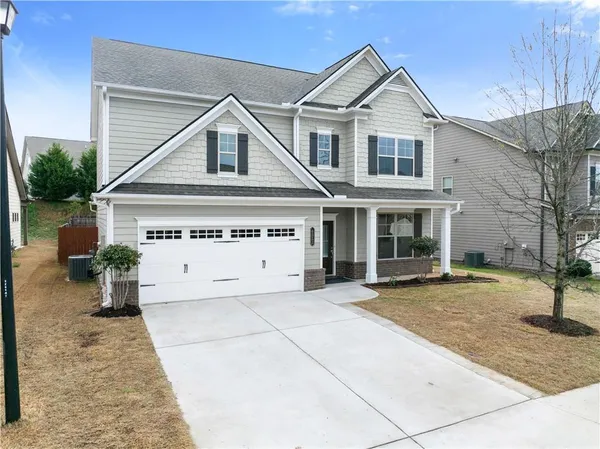 a front view of a house with a yard