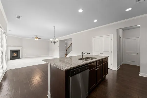 a kitchen with a sink a stove and refrigerator
