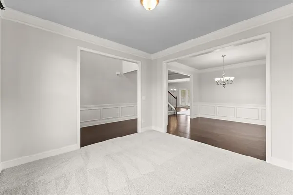 a bedroom with a bed and a mirror