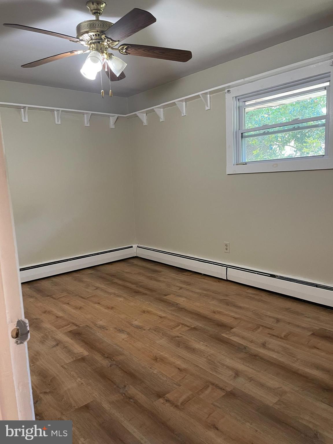 511 Heather Road Exton, PA 19341 - Photo 6 of 9 a view of an empty room with a window