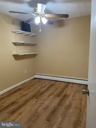 a view of a room with racks on the wall