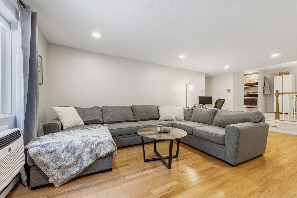10 Erick Road, Unit 42 Mansfield, MA 02048 - Photo 4 of 33 a living room with furniture and a couch
