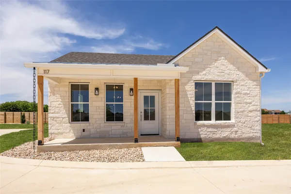 front view of a house with a yard