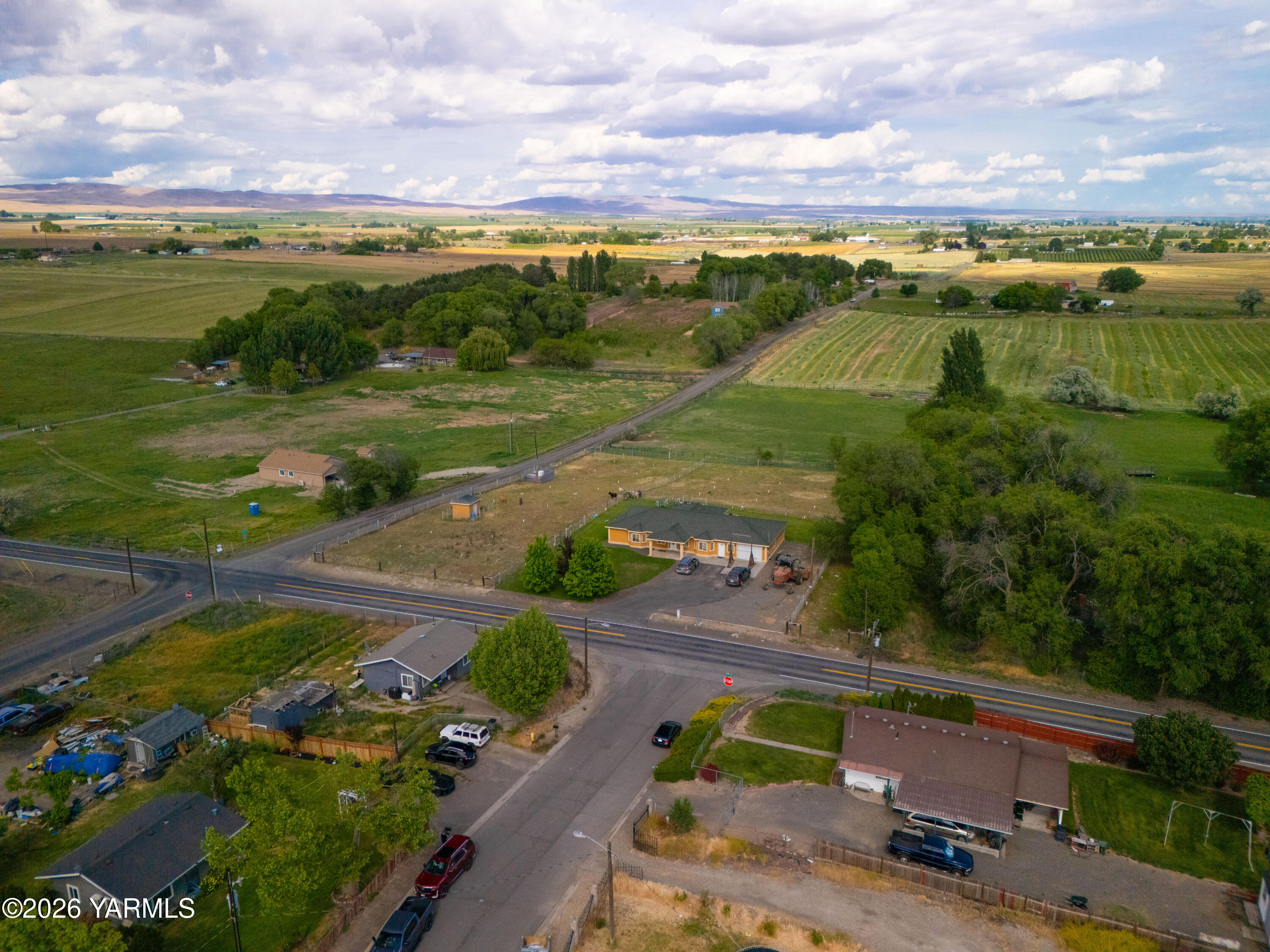 1811 Beam Road Granger, WA 98932 - Photo 25 of 26 aerial view of a city with lots of residential buildings and mountain view in back