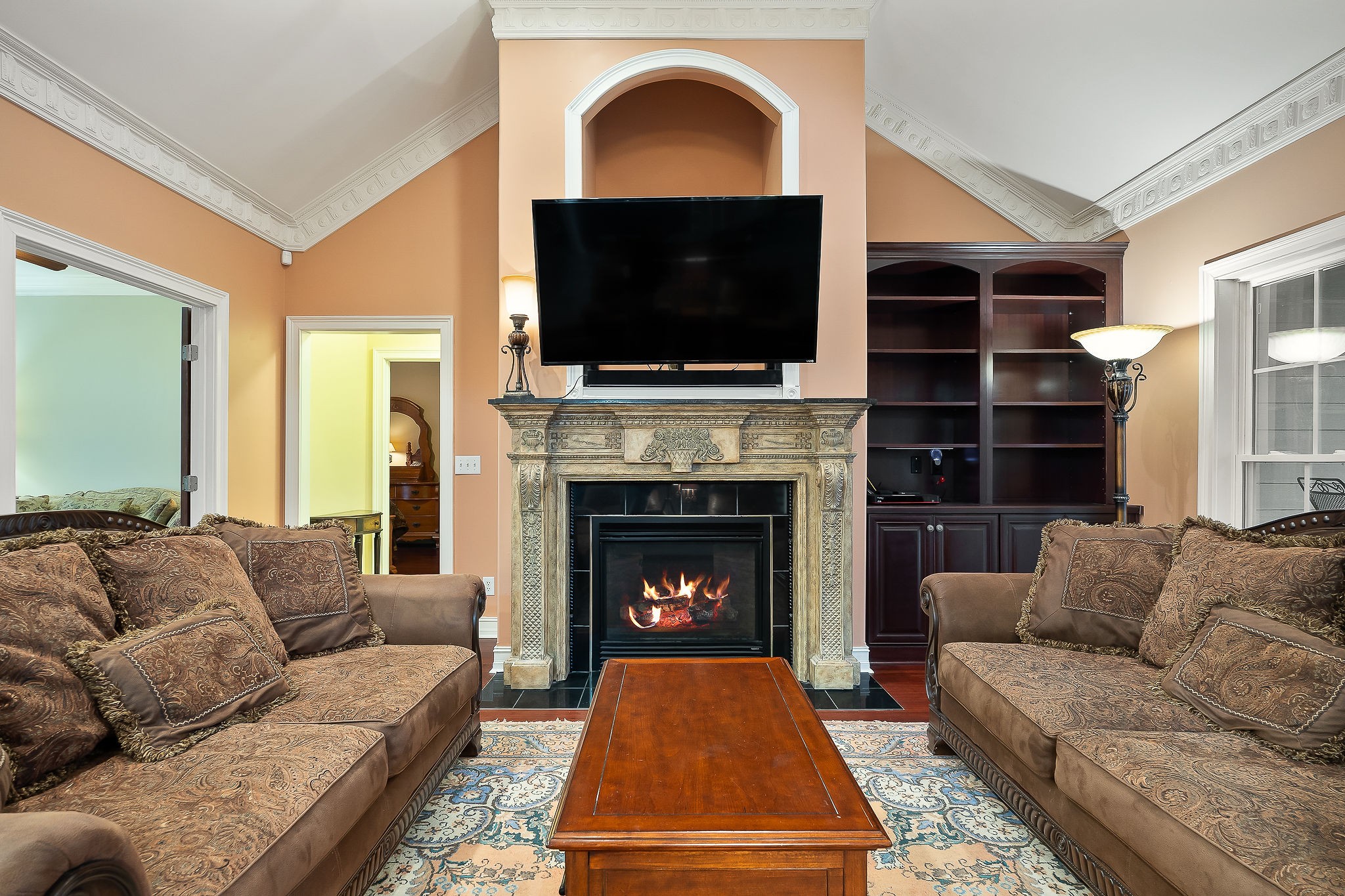 120 Dunrobin Court Sparta, TN 38583 - Photo 5 of 40 a living room with furniture a flat screen tv and a fireplace