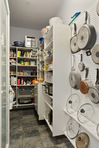 a kitchen with a cabinets and a window