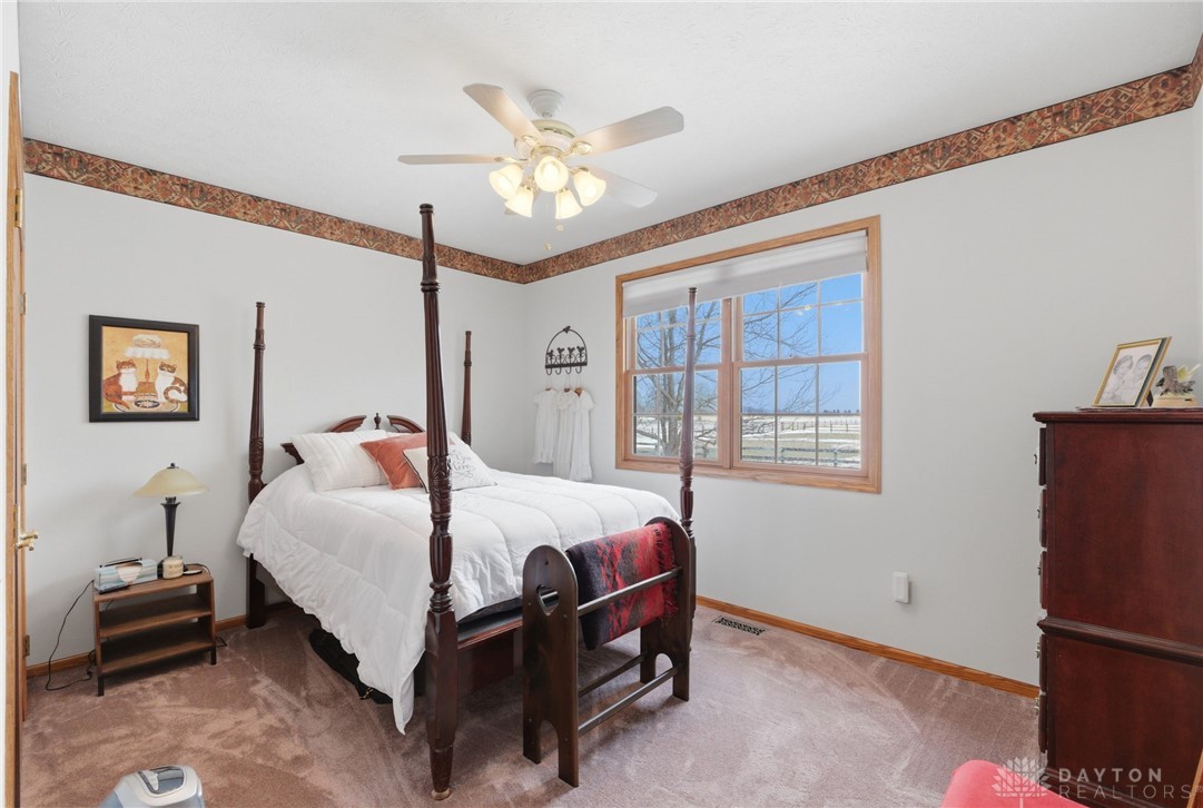 1540 Jasper Road Xenia, OH 45385 - Photo 38 of 91 This spacious bedroom offers comfortable living with carpeted flooring and large windows for ample natural light.