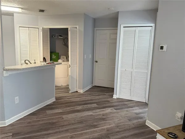 a room with a bed and a television