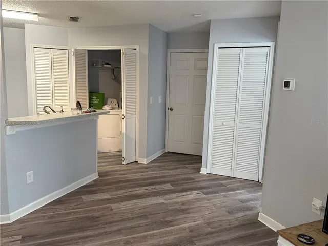 a room with a bed and a television