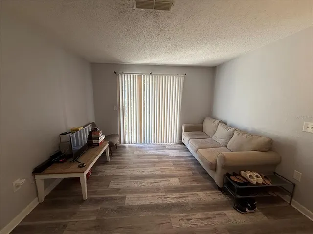 a bathroom with a sink a toilet and a shower curtain