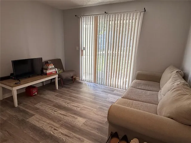 a kitchen with a sink and a refrigerator