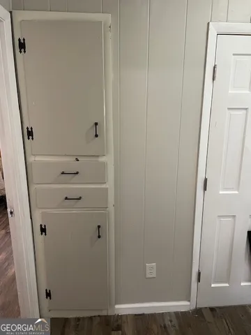 a view of a dining room with furniture and window