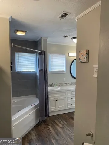 a bedroom with bed and a chandelier