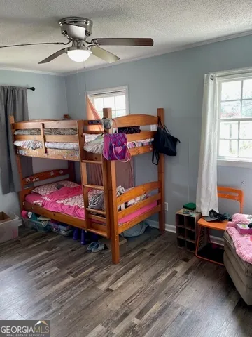 a view of a hallway view with wooden floor and furniture