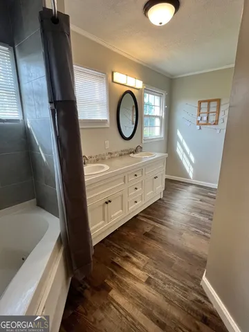 a white toilet sitting next to a sink